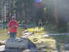 Tom fishing at East Lake, Mr. Gates in background